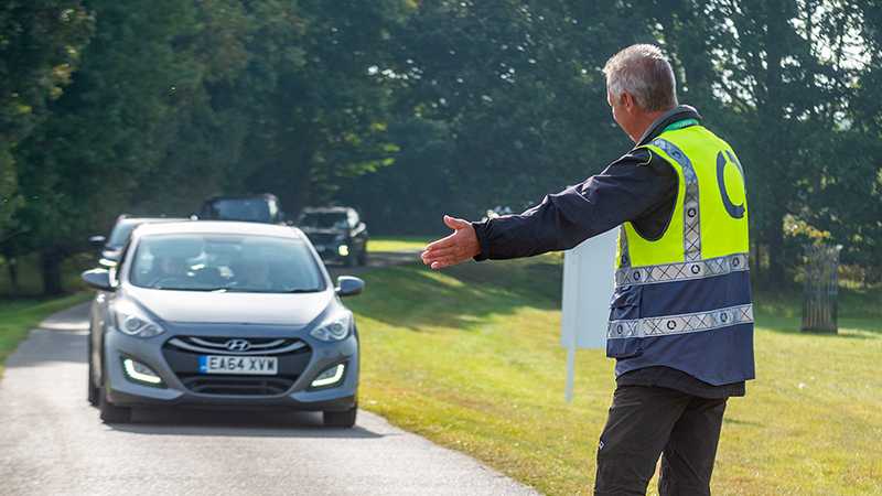 A Tracis Events Marshal directing traffic